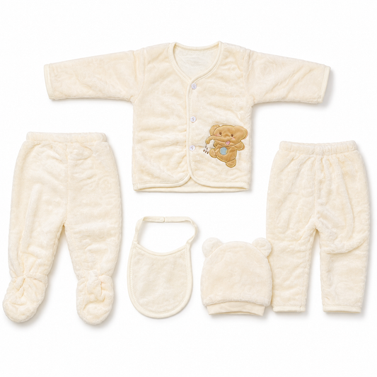 Cream newborn plush baby clothing set flat lay with teddy applique