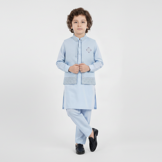 Child wearing a light blue traditional outfit on a white background.