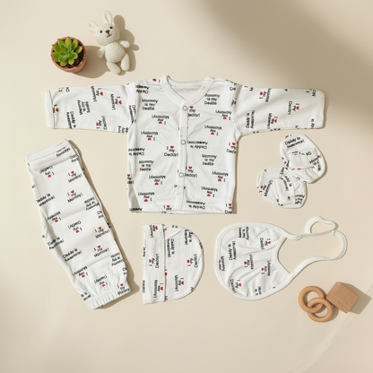 Baby clothing set with printed text on a beige background