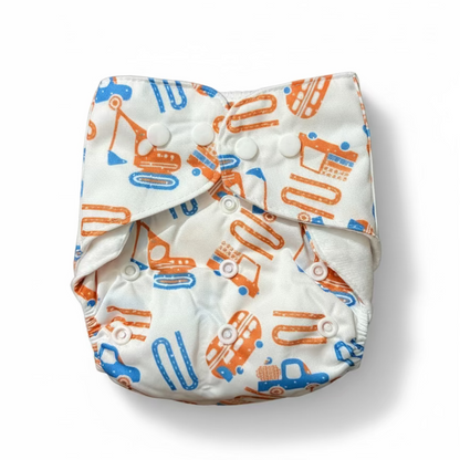 White diaper with orange and blue patterns on a brown background