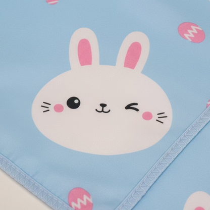 Children's blanket with a cartoon bunny face on a blue background