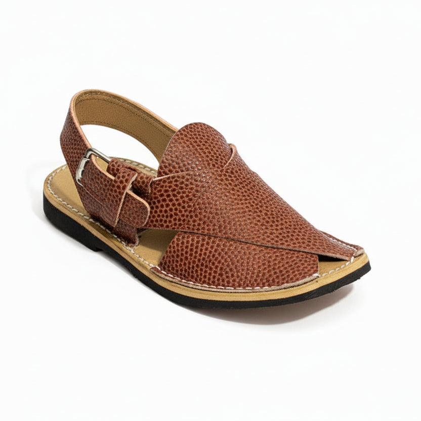 Pair of brown sandals with visible brand labels on a green background