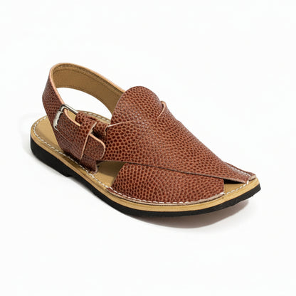 Pair of brown sandals with visible brand labels on a green background
