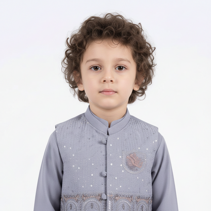 Child wearing a gray traditional outfit on a white background