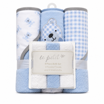 Pink whale baby bath towel set flat lay with hooded towel and washcloths