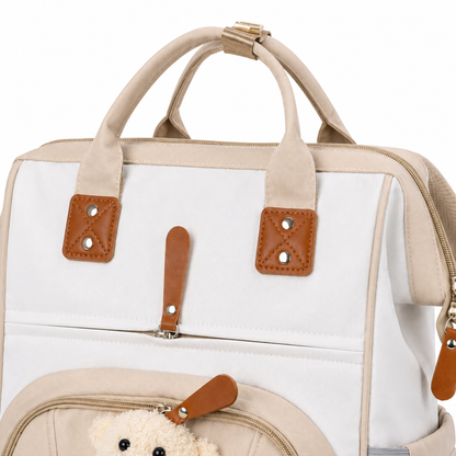 Beige baby diaper backpack handle and fabric detail product photo on white background