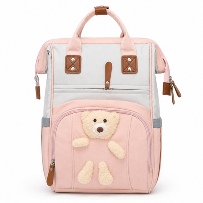 Pink baby diaper backpack with teddy applique front view product photo on white background
