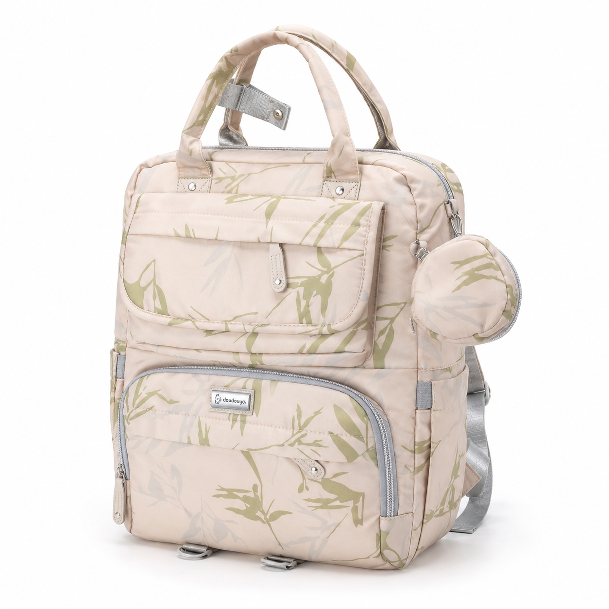 Beige botanical print mother and baby diaper backpack front three-quarter view with round accessory pouch