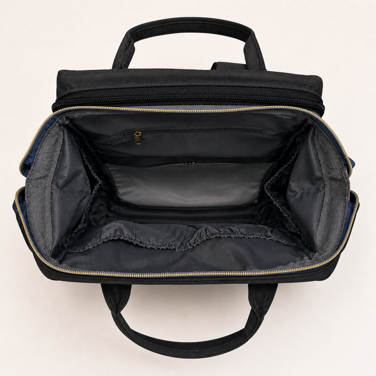 Empty organized interior of black mother and baby backpack