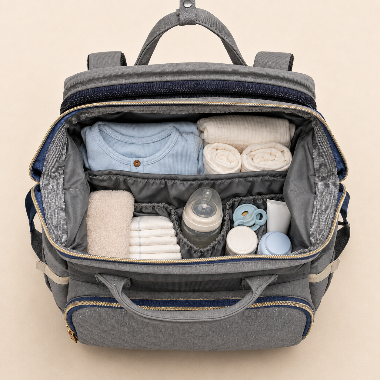 Charcoal grey mother and baby backpack packed with newborn essentials
