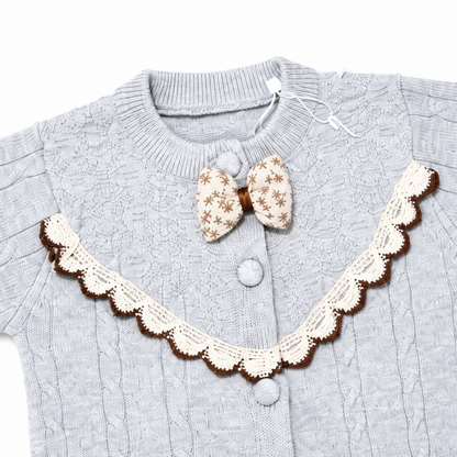 Gray cable knit baby romper scalloped bib bow and button detail