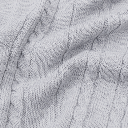 Gray cable knit baby romper fabric texture close-up