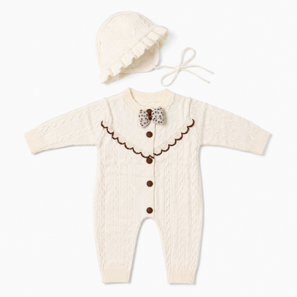 Ivory cable knit baby romper set with matching bonnet front hero view