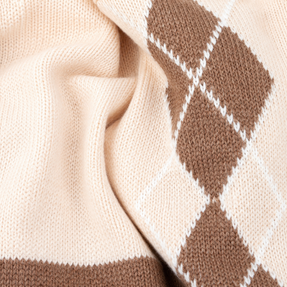 Knitted argyle baby romper fabric texture detail
