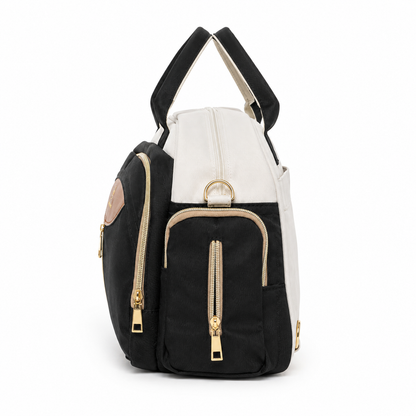Mom’s Love baby diaper carry bag in black and cream side pocket detail