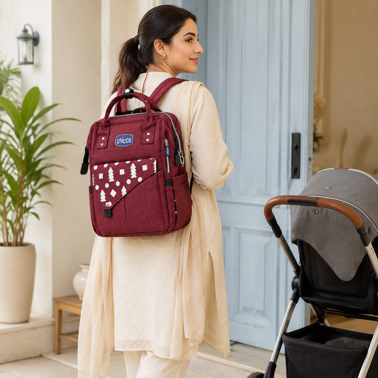 Pakistani mother wearing burgundy mother and baby backpack