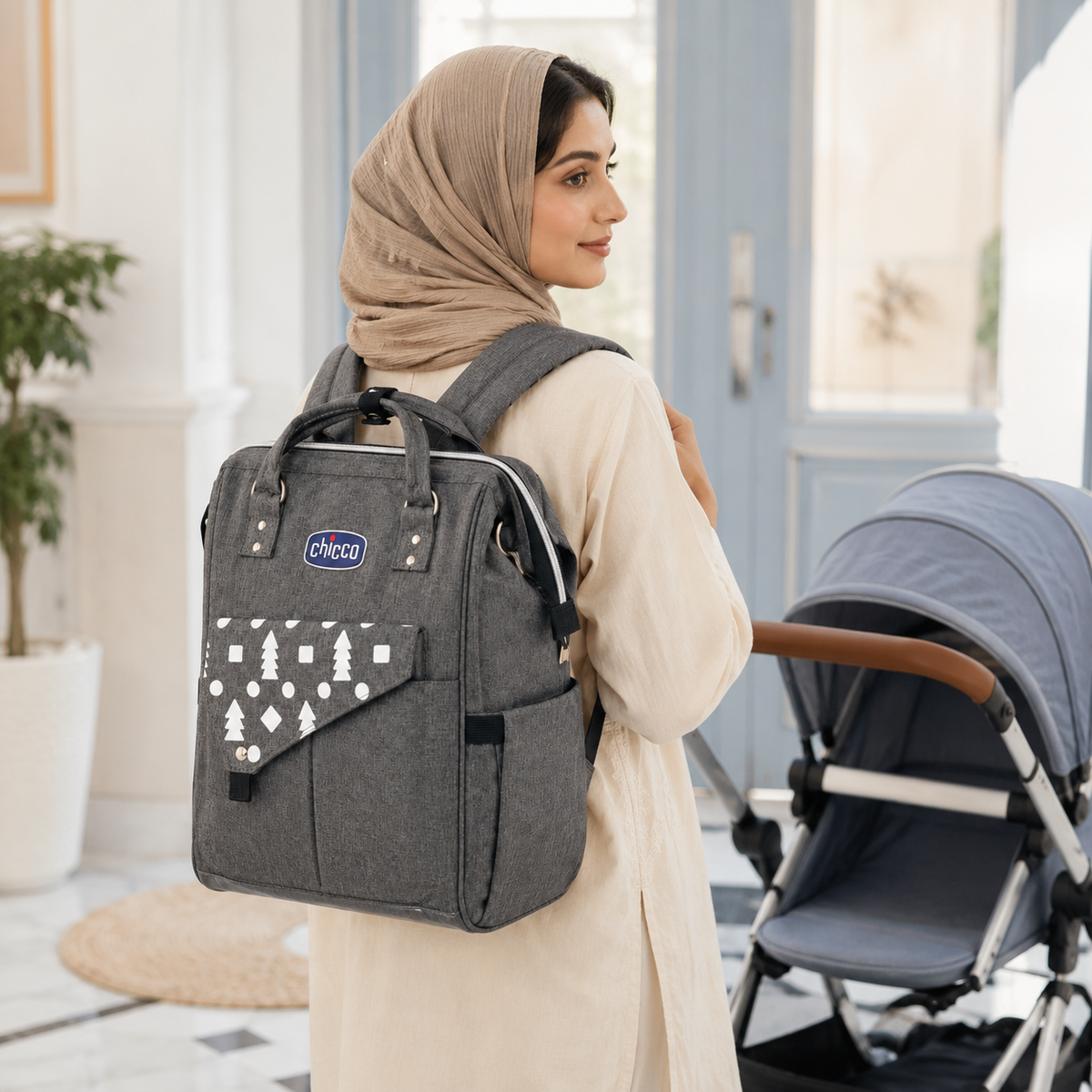 Mother wearing grey mother and baby backpack