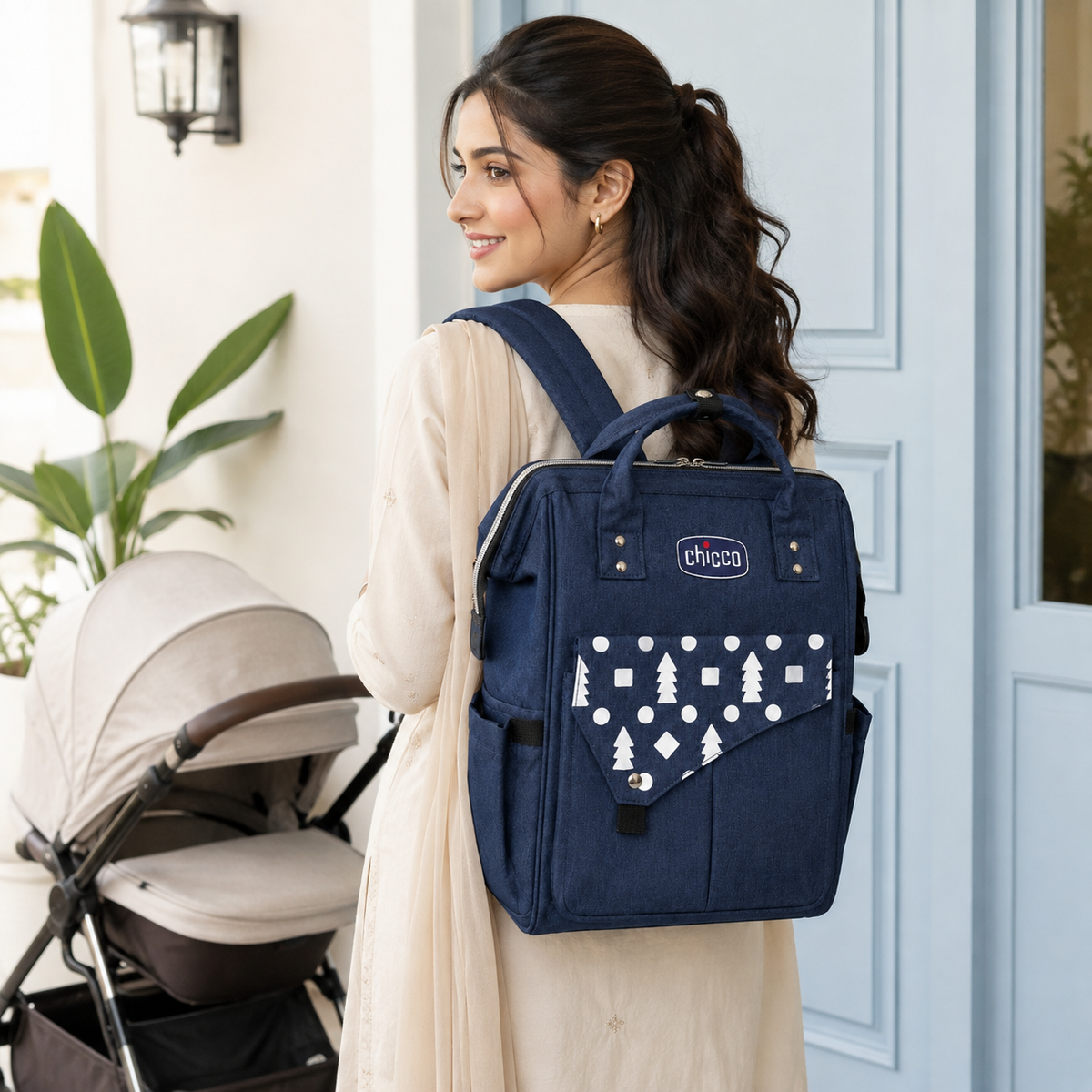 Pakistani mother wearing navy mother and baby backpack