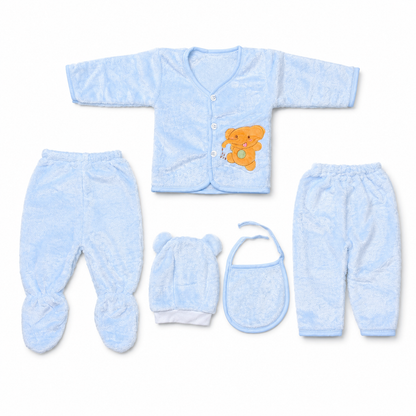 Blue newborn plush baby clothing set flat lay with teddy applique