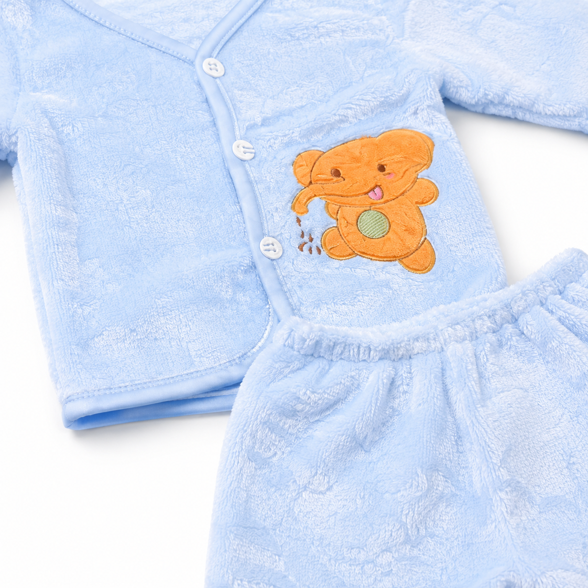 Blue newborn plush baby clothing set teddy applique close-up photo