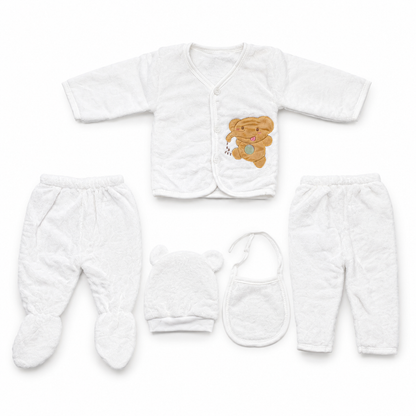White newborn plush baby clothing set flat lay with teddy applique