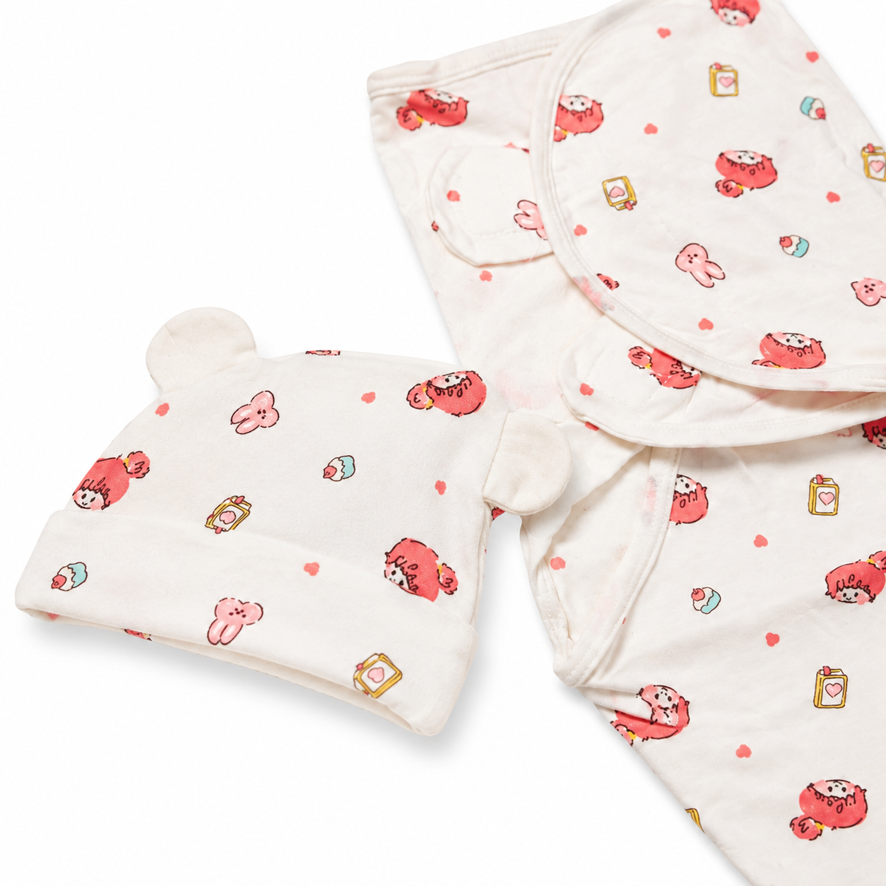 Close-up product photo showing newborn swaddle fabric texture stitching and printed pattern
