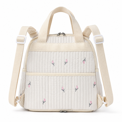 Quilted floral baby diaper backpack back view with shoulder straps